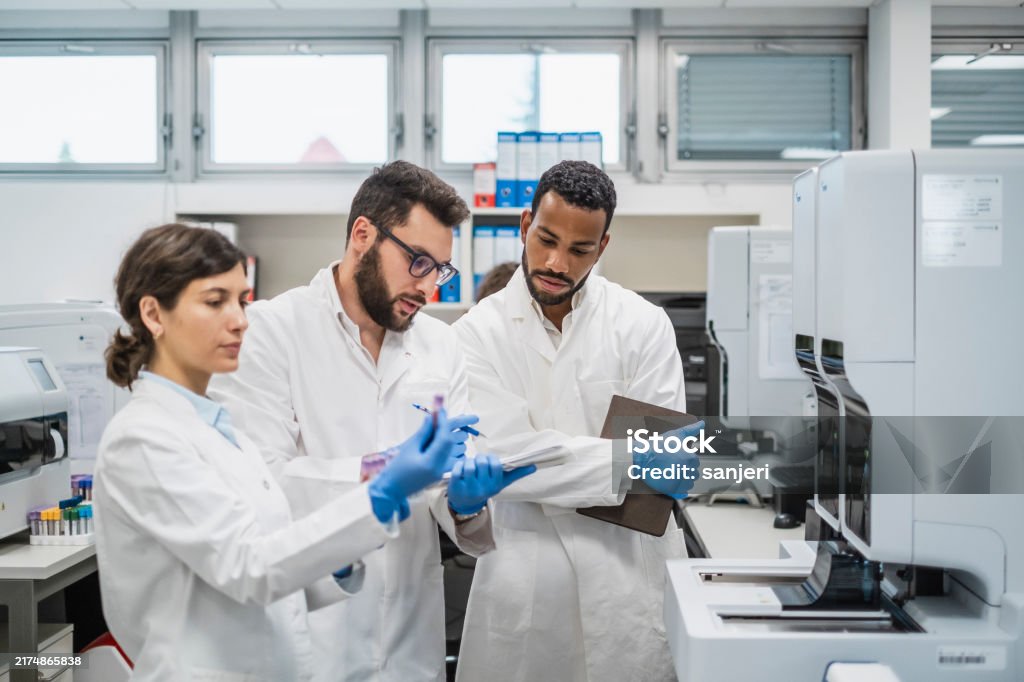 Small Lab Team Diverse Lab Team With Digital Tablet Analyzing Samples Stock Photo ...