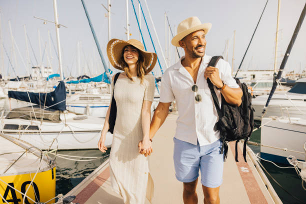 istock Couple enjoying a sunny day at the marina 2174869940