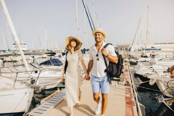 istock Couple enjoying a sunny day at the marina 2174869946