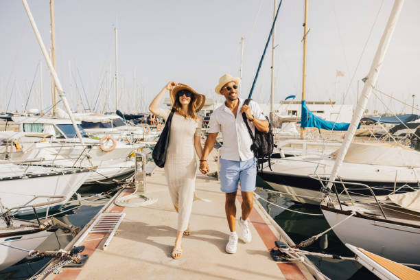 istock Couple enjoying a sunny day at the marina 2174869979
