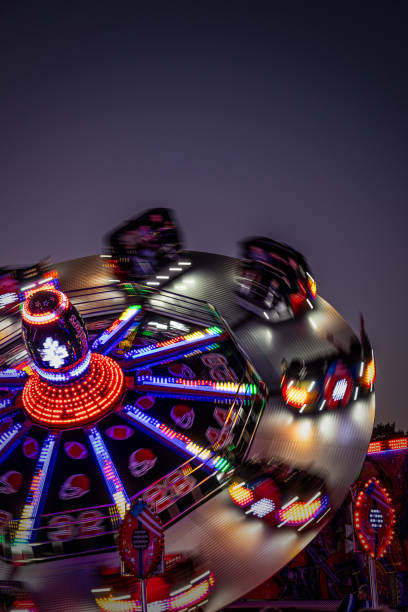 istock 'Witney Feast' Travelling Fairground Ride - 'Superbowl' Light Trails 2174877204