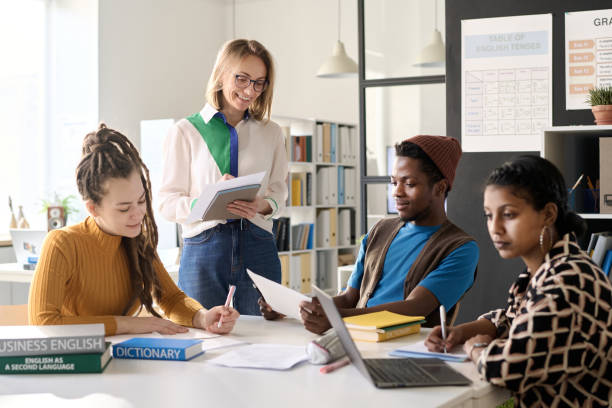 istock Female Teacher in Class with Group of College Students 2174878291