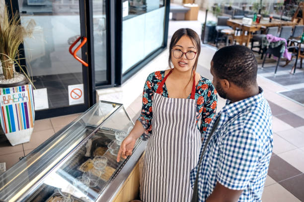 istock Asian waitress working at cafe serving regular customer recommending ice cream 2174878486