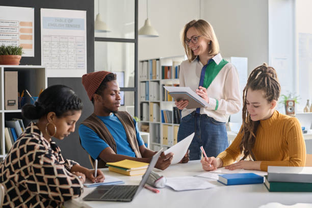 istock Female Teacher Enjoying Class in School or College with Students 2174878532