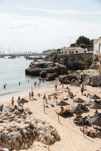 istock Sunbathing at Praia da Rainha, Cascais 2174879981