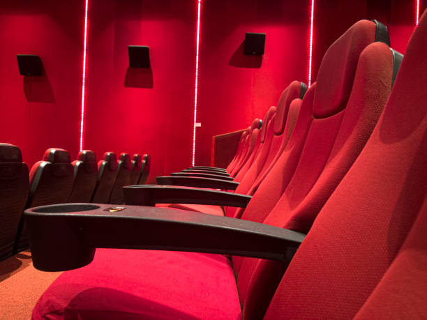 istock Empty comfortable red seats with numbers in cinema 2174880943