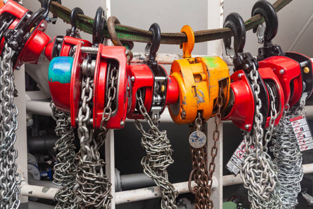istock Chain hoists for lifting weights in a workshop close-up. 2174883019