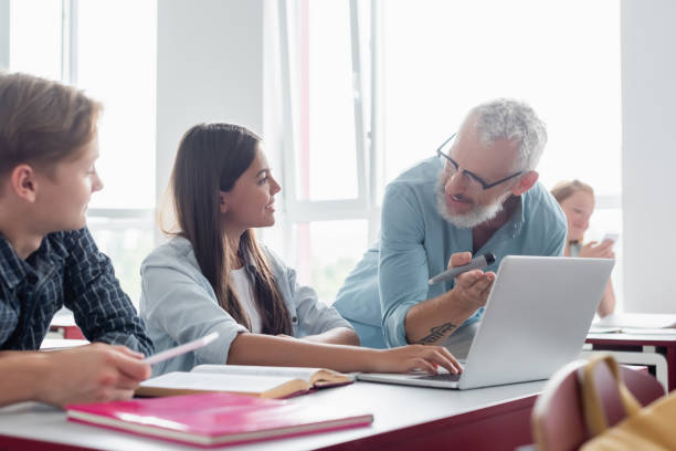 istock Engaging teens in a classroom discussion about technology during a school day 2174883357