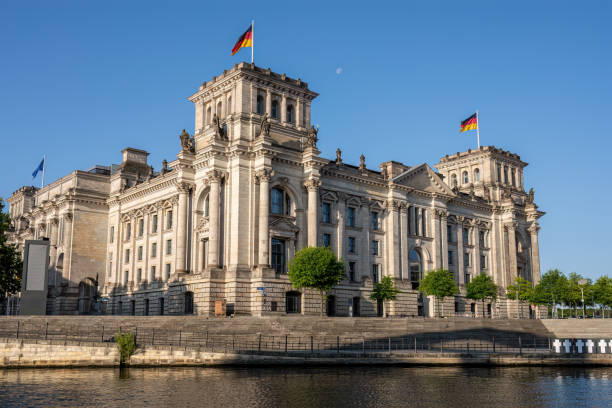 istock The historic Reichstag at the river Spree 2174883397
