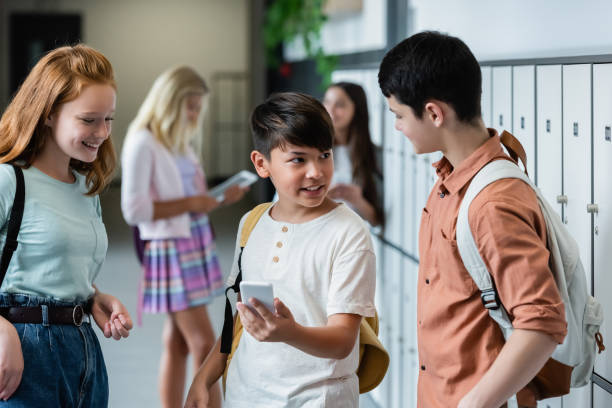 istock Students interact and share moments in a vibrant school hallway during a lively day 2174883765