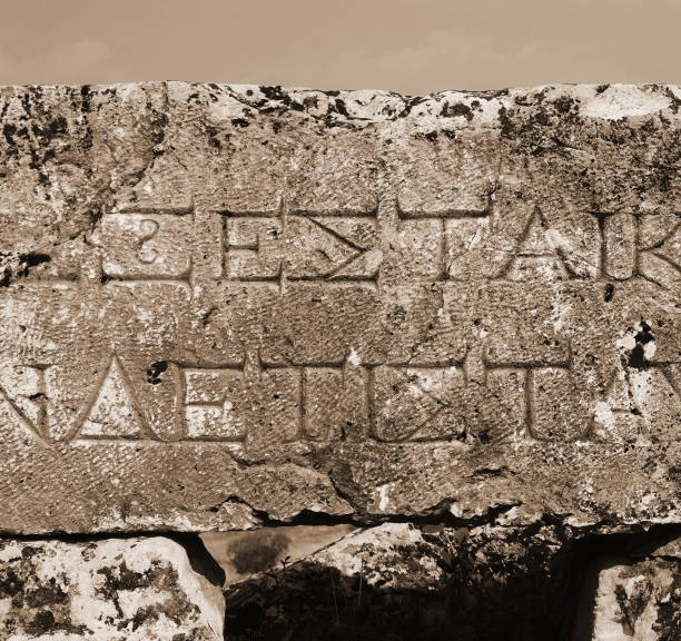 Ancient Stone Carving Text Close-Up Sepia Tone