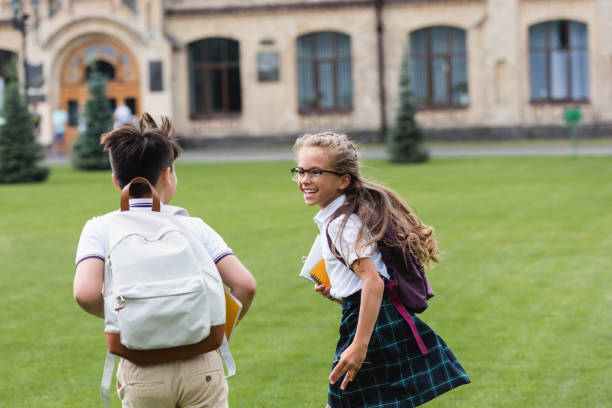 istock Children joyfully playing outdoors after school, sharing stories on a sunny day 2174886246