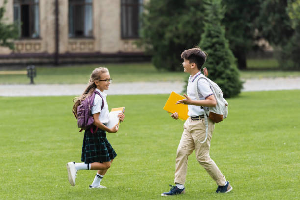 istock Joyful kids enjoy their time outdoors after school, sharing laughter on a sunny afternoon 2174886251