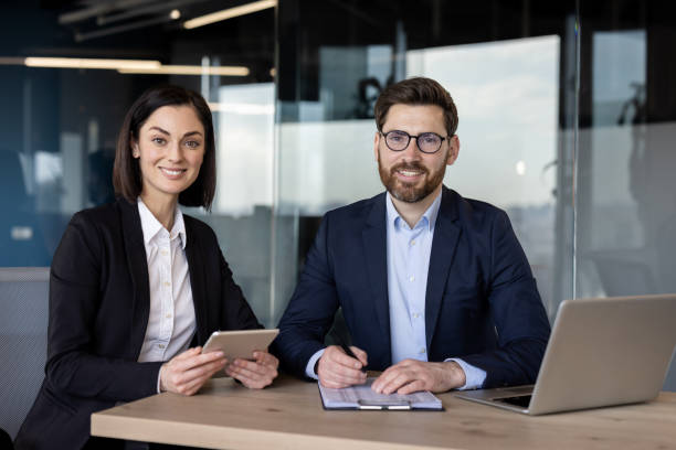 istock Professional business meeting with confident colleagues discussing project strategy in modern office setting 2174886486