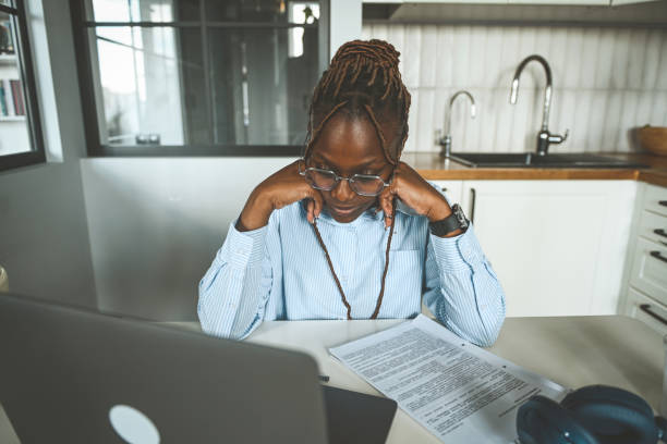 istock young woman tired at work 2174890874