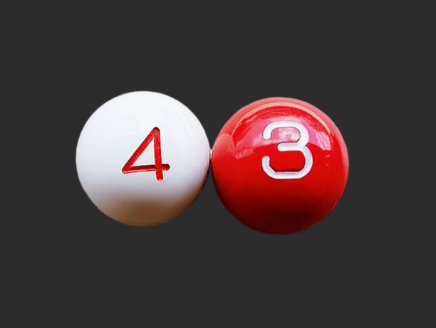 istock White and red balls with the number four and three 2174891873