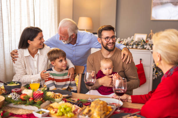 istock Happy multi-generation family having Christmas dinner at home 2174892609