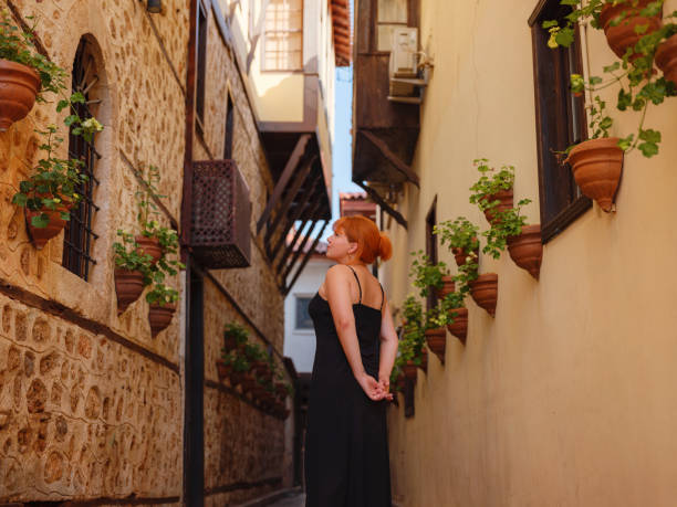 istock Young woman walking in old town, Antalya, Turkey 2174895607