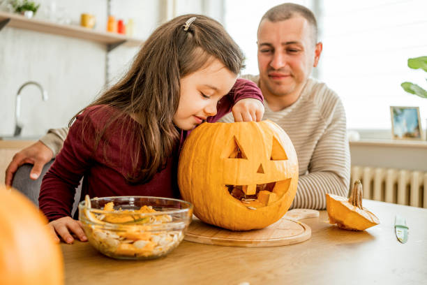 istock Father and daughter making Halloween decorations 2174897006
