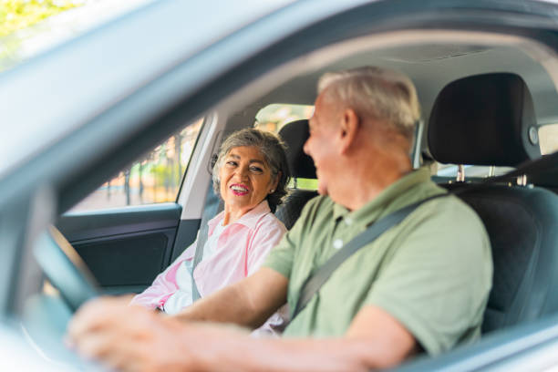 istock Happy senior couple talking inside car 2174899524