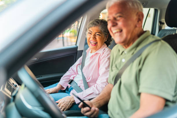 istock Happy senior couple talking inside car 2174899582