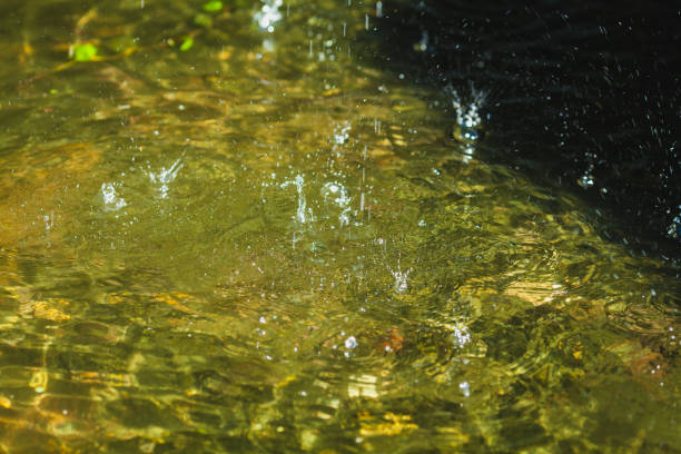splashes on the water n the cave in a summer day