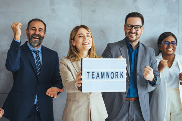 istock Positive team motivation. Diverse creative team looking happy 2174899816