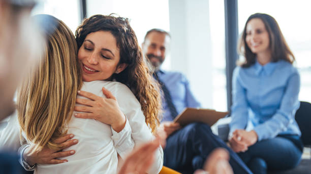 istock A multi-ethnic group of adults are attending a group therapy session. 2174899877