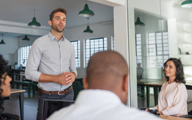 istock Manager and his staff having a meeting in an office 2174900455