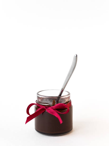 istock Chocolate jar with ribbon and spoon on white background 2174901047