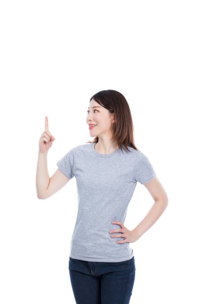 istock Young Asian woman pointing up 2174905402