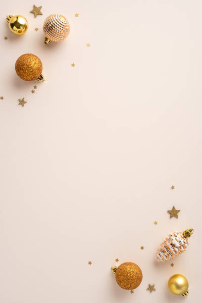 istock A festive vertical composition featuring golden Christmas ornaments and star confetti set against a soft pastel background, capturing a celebratory holiday spirit 2174905577