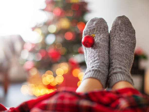 istock Knitted socks on Christmas tree background 2174907339