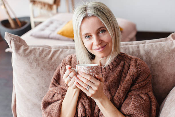 istock Calm peaceful Woman drinking tea or coffee at home 2174907441