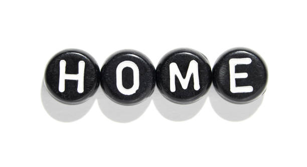 istock Black round letter blocks spelling home on white background for interior design 2174908288