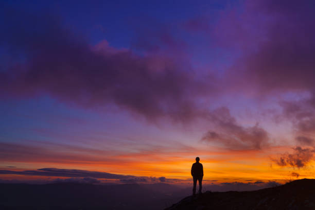 istock Man at sunset. Sky at sunset in San Miguel de Aralar, Navarra. 2174909338