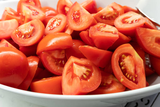 istock Large Plate with Fresh Tomato Slices 2174915726