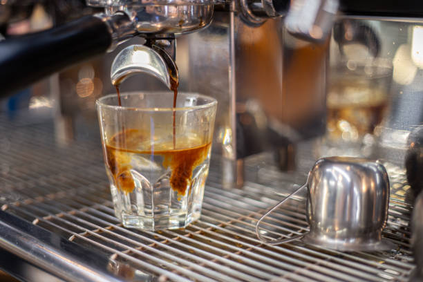 istock Making coffee by a barista in a coffee machine. The coffee machine makes coffee. 2174918807
