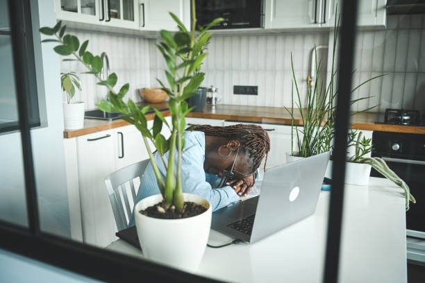 istock young woman tired at work 2174918833
