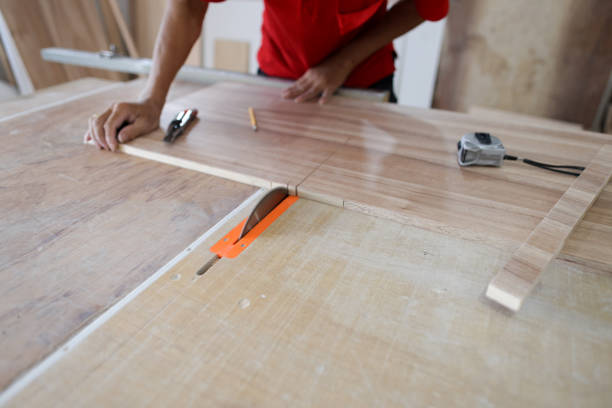 istock Home renovation worker cutting wooden boards 2174921586