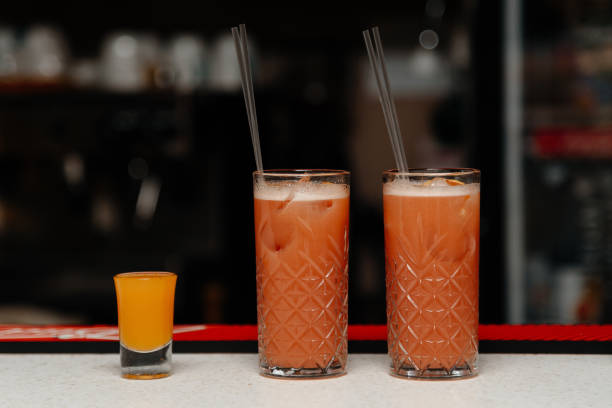 istock two glasses with red strawberry cocktails 2174924091
