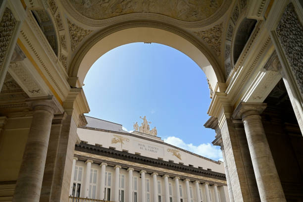 Naples, Italy, september 13, 2024 : San Carlo Theatre seen from under the entrance arch of the Umerto