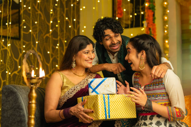 istock Siblings with gift boxes celebrating Diwali at home 2174924621