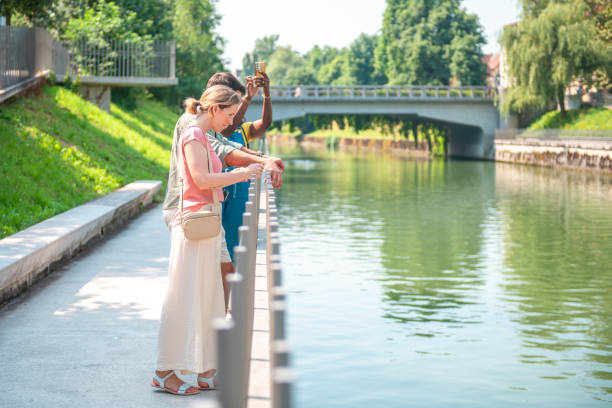 istock Diverse Friends on Sunny City Riverwalk 2174924901