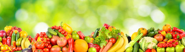 istock Panorama multicolored fresh fruits and vegetables on green background. 2174925403