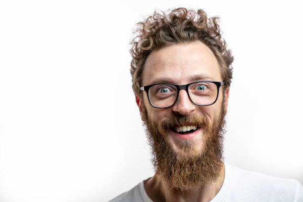 istock Satisfied cheerful handsome man smiles at camera isolated over white background. 2174925691