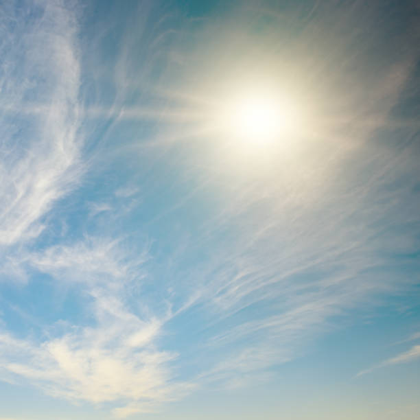 istock Bright sun on blue sky and cirrus clouds. 2174925845
