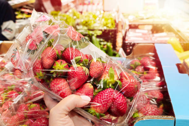 istock Strawberry in hand in shop 2174926944