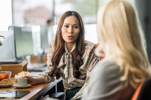 istock Diverse Female Executives in Strategy Session with Coffee 2174927357