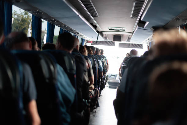 istock View from the back of a crowded bus during a daytime journey 2174927563